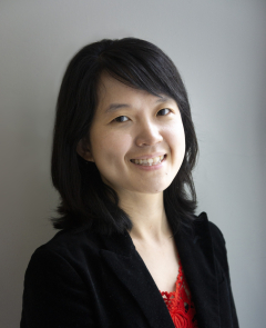 a woman smiling for a portrait