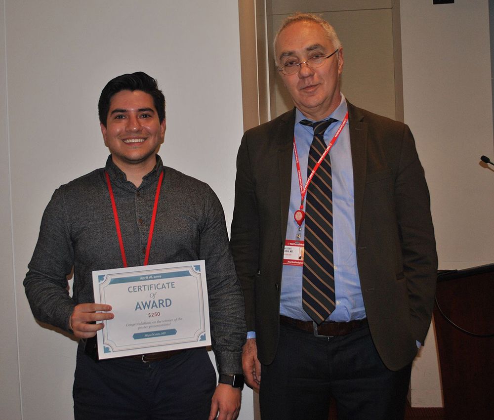 Dr. Miguel Cantu (left) received the 2019 Resident Award for the Best Scientific Poster Presentation.